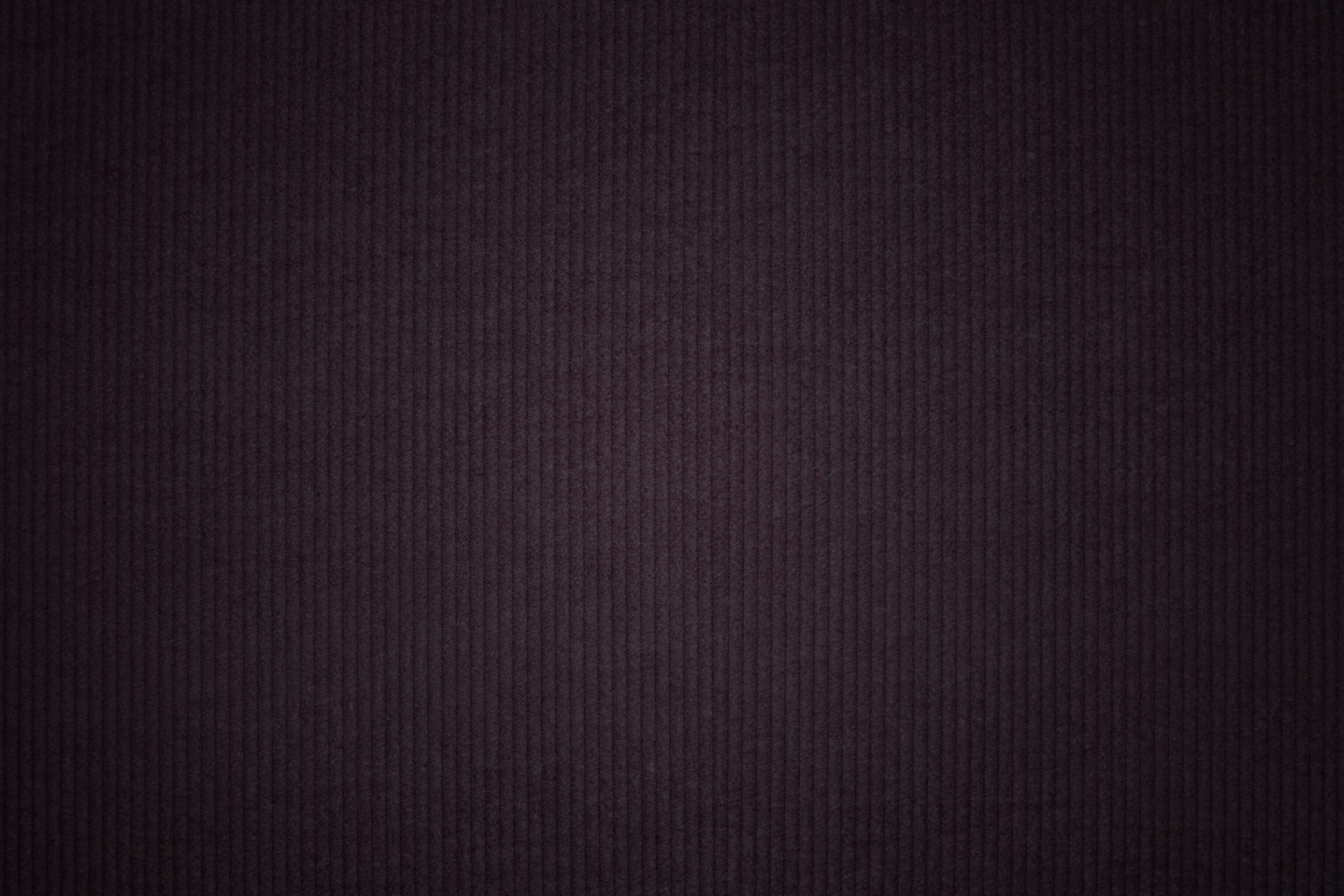 Dark corduroy fabric textured backdrop